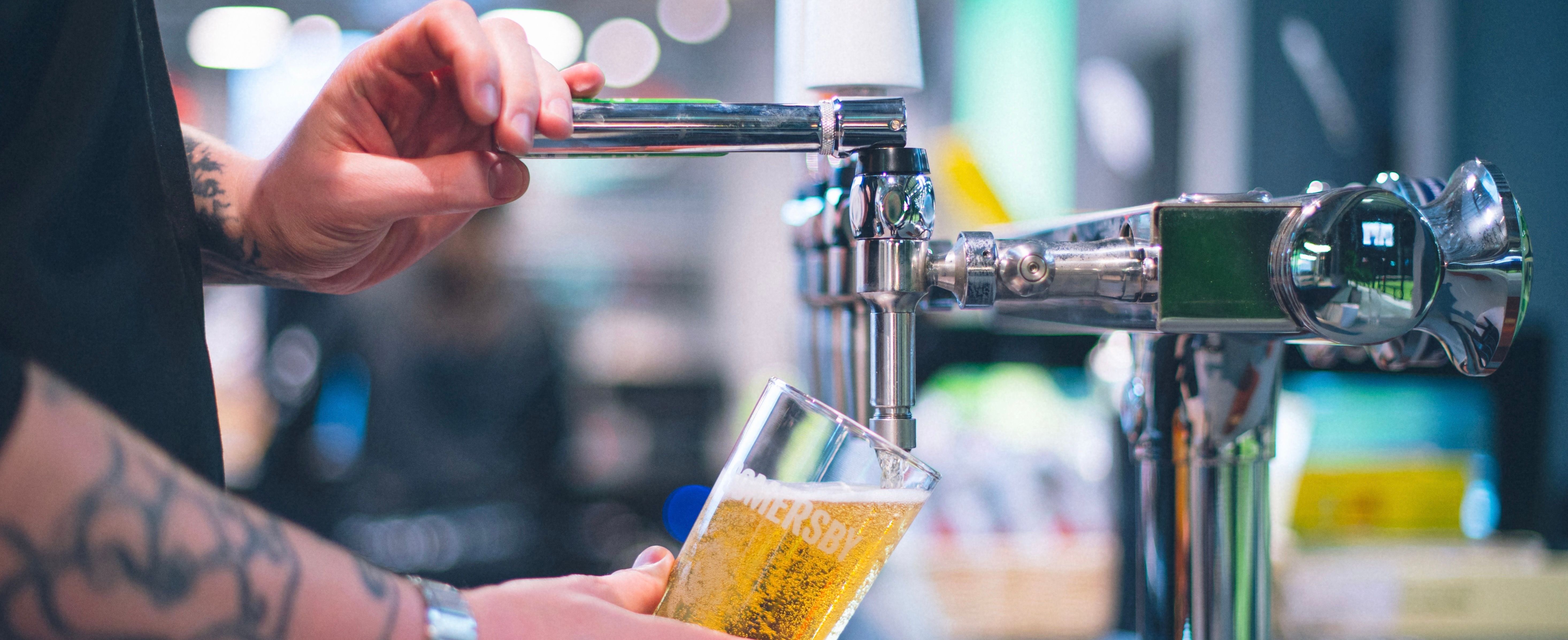 Pouring beer from tap